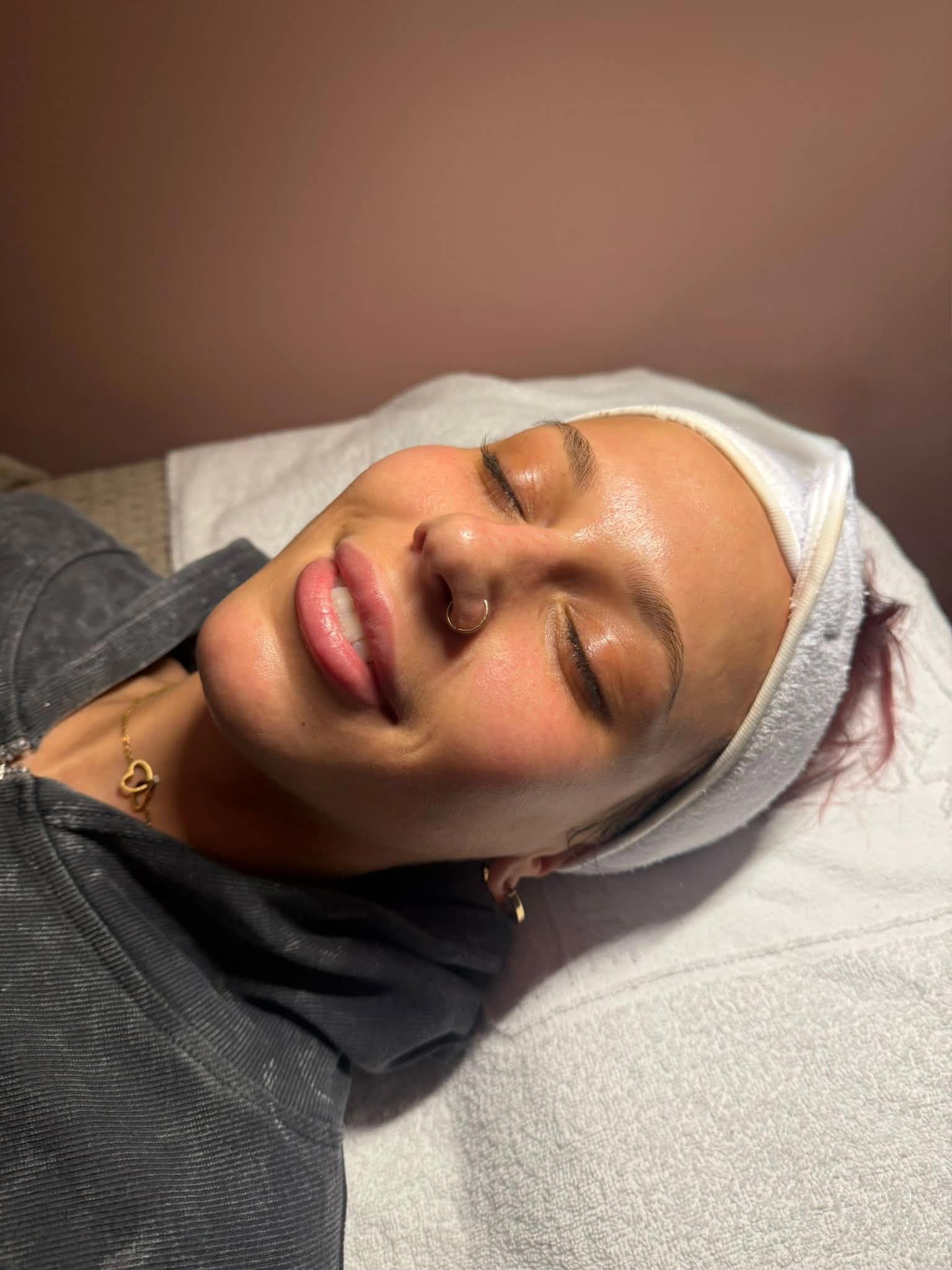 Client smiling after facial treatment